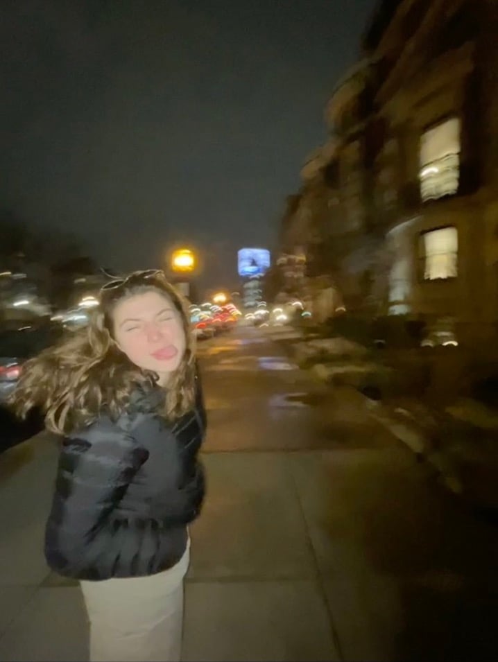 girl on the side street with silly face