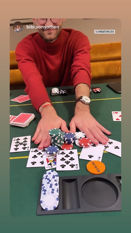Chelsea House member playing poker at the student res lounge