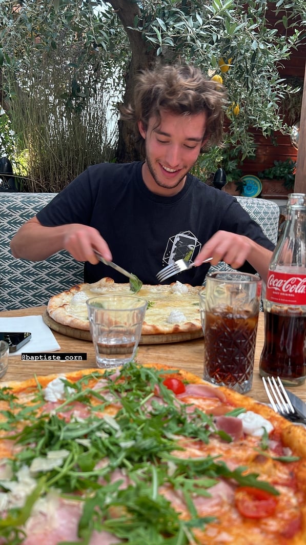 Boy eating pizza