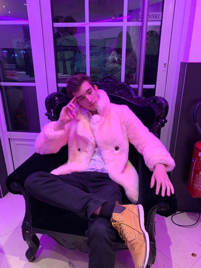 Baptiste sitting on a chair