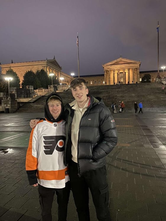 Two young guys in Philly at Rocky steps